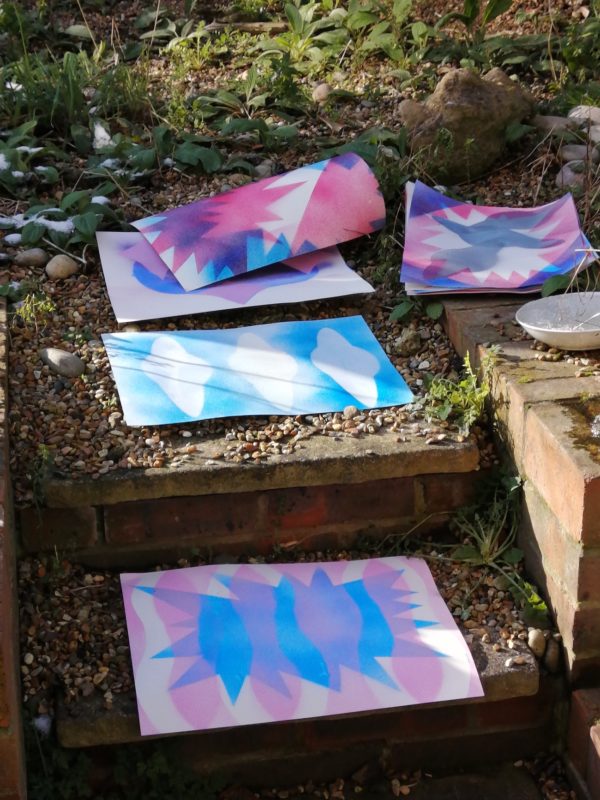Spray painted stencils drying outside