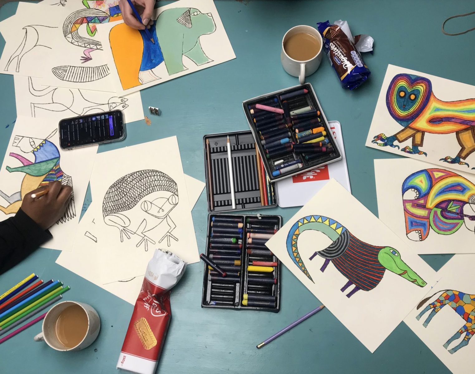 Hart Club artists colouring in pages of Animalgam.