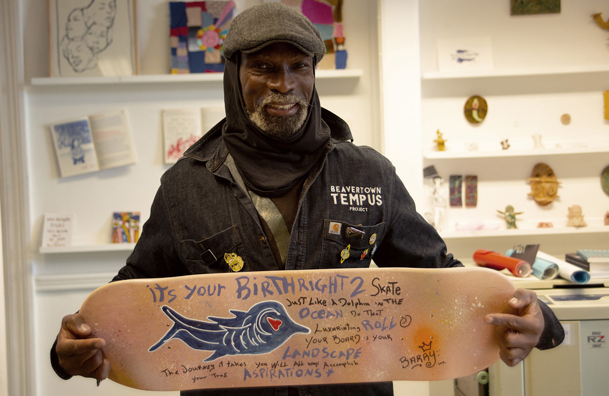 Hart School artist Barry with his finished board design.